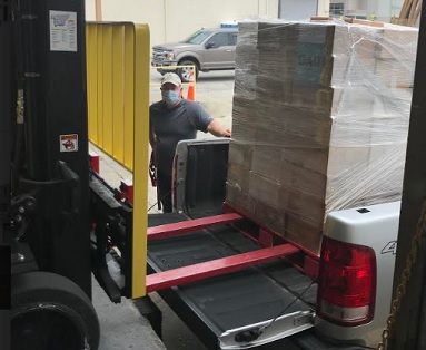 Georgia Power employees from Plant Bowen donate pallets of frozen food to local shelter